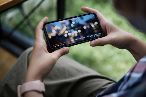 While quarantine a women watching live streaming by application on smartphone